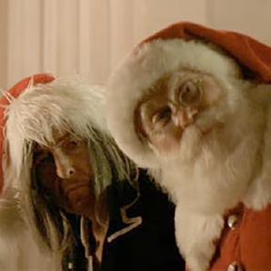 Bob Dylan (left) in the video for "Must be Santa"
