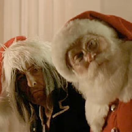 Bob Dylan (left) in the video for "Must be Santa"